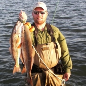 Preston Bean shows off his string of Red Drum