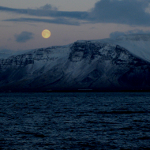 Full moon rising over Esja near Reykjavik, Iceland