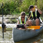 Brandon Cheek and Jillian Goreschel using side scan sonar to map substrates in the South Llano River near Junction, Texas